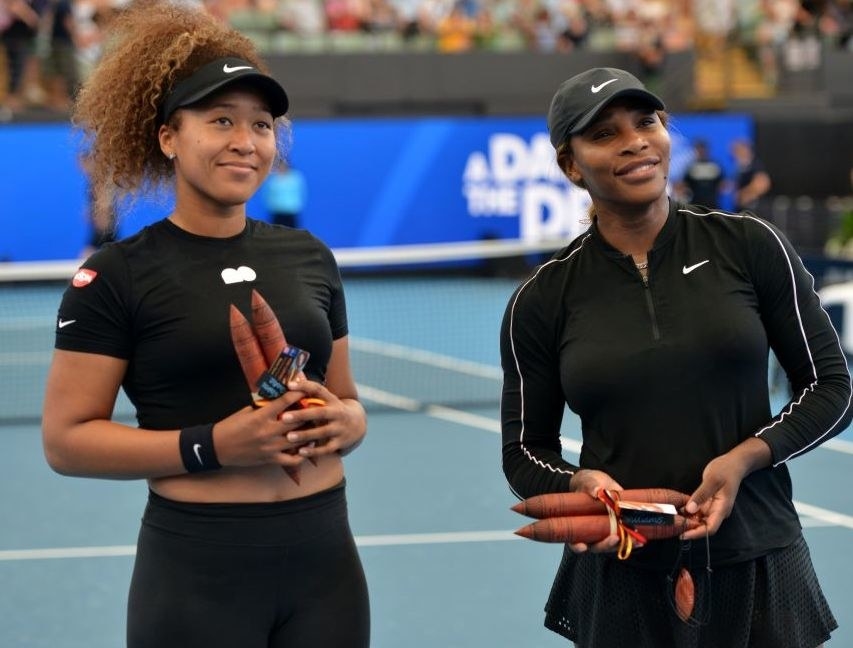 Williams and Osaka at a women&#x27;s singles match in 2021
