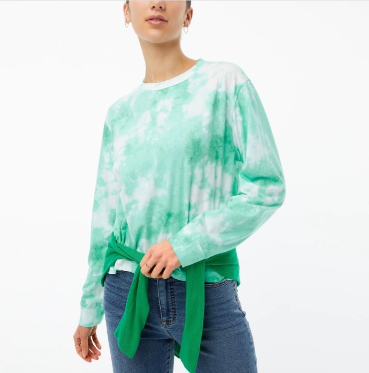 An image of a model wearing a cotton green tie-dye boxy tee