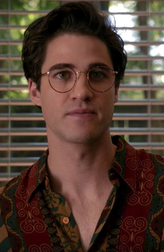 close up of Darren wearing the same style of glasses and short hair