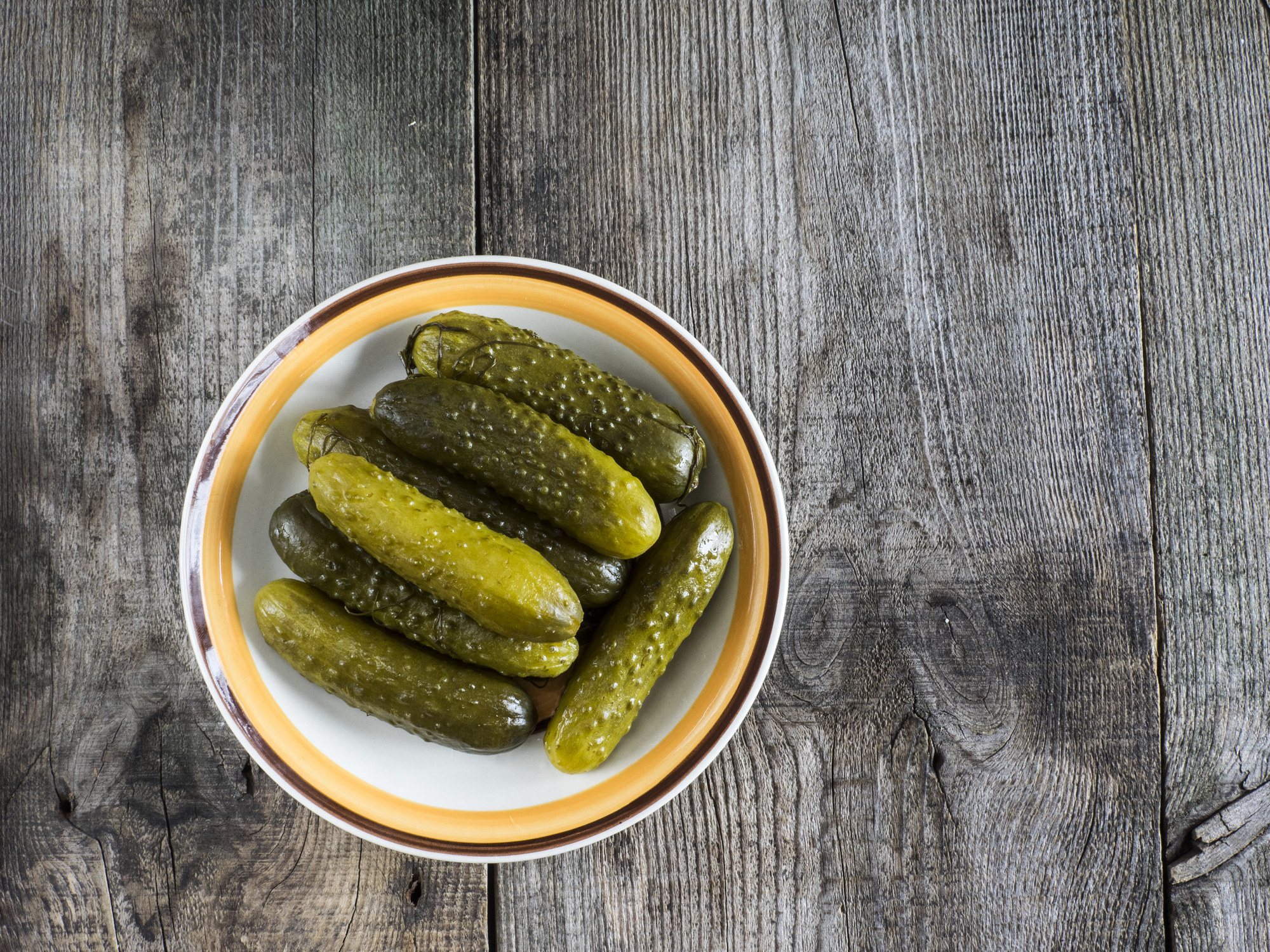 a bowl of whole pickles