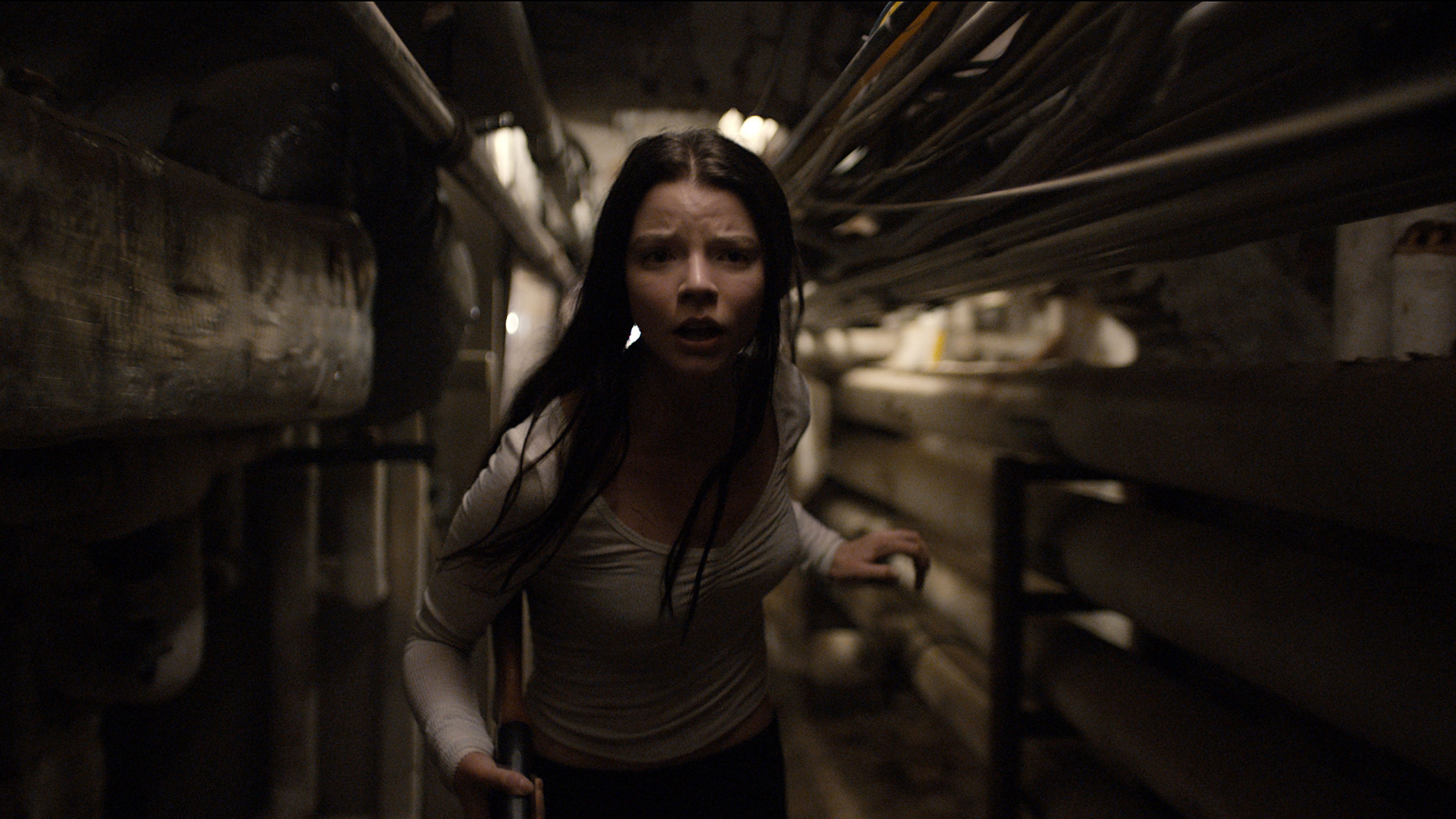 Anya Taylor-Joy runs down a tunnel