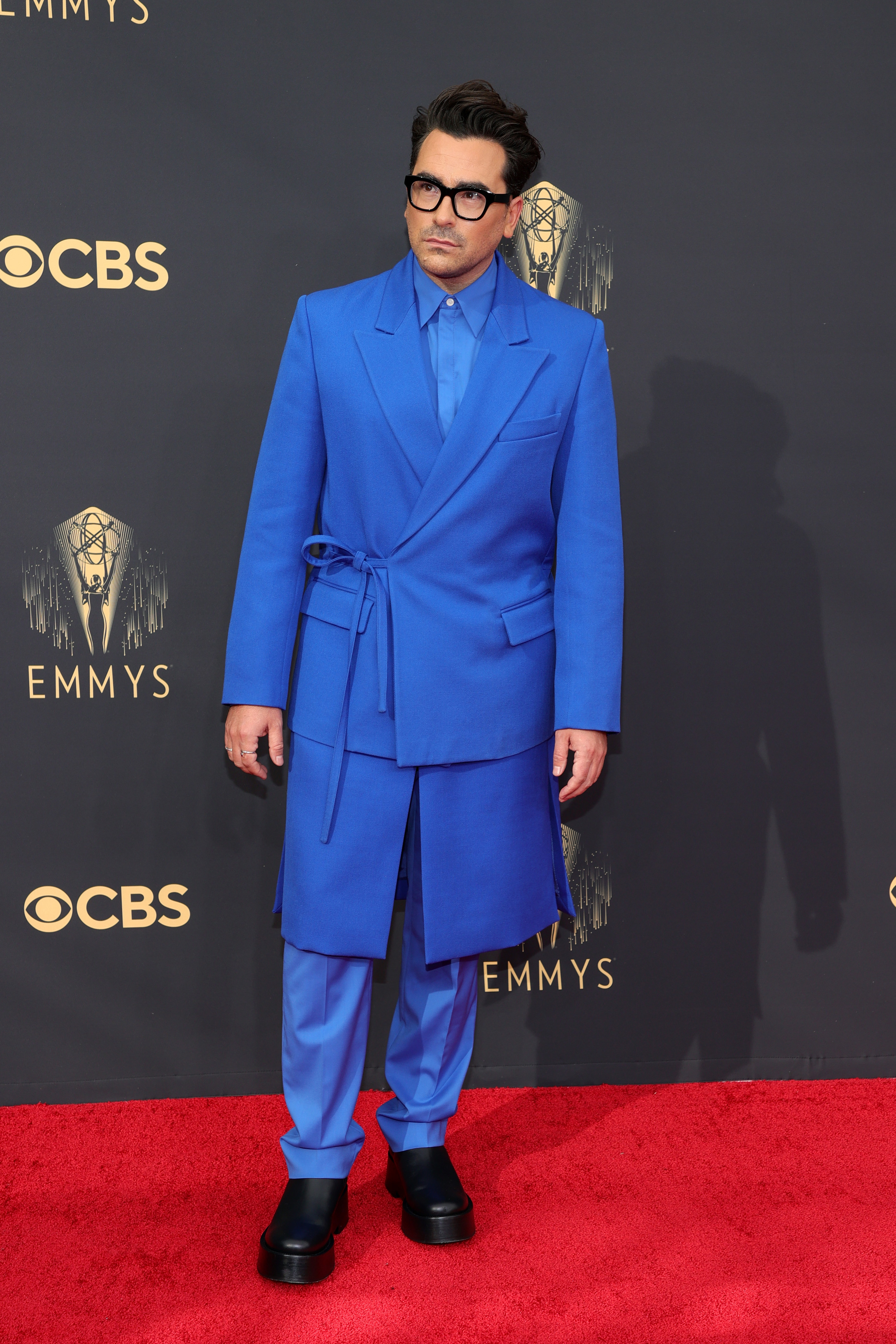 Dan wears the blue suit