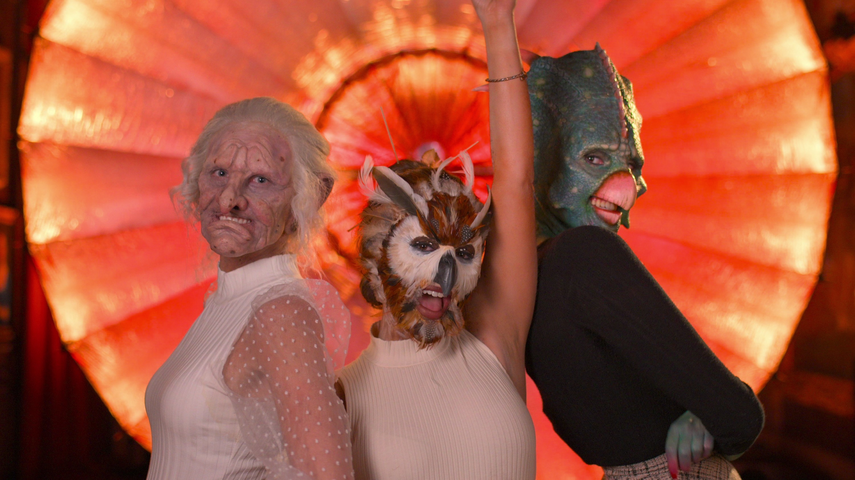 three of the cast members in face prosthetics