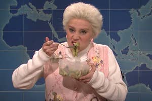 Kate McKinnon eating some sort of vegetable dish on Weekend Update