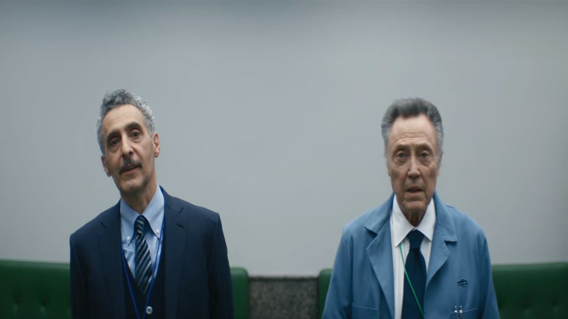 John Turturro and Christopher Walken stand and look at something