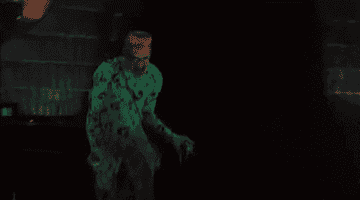 A gif of the Riddler prancing around with an explosion behind him