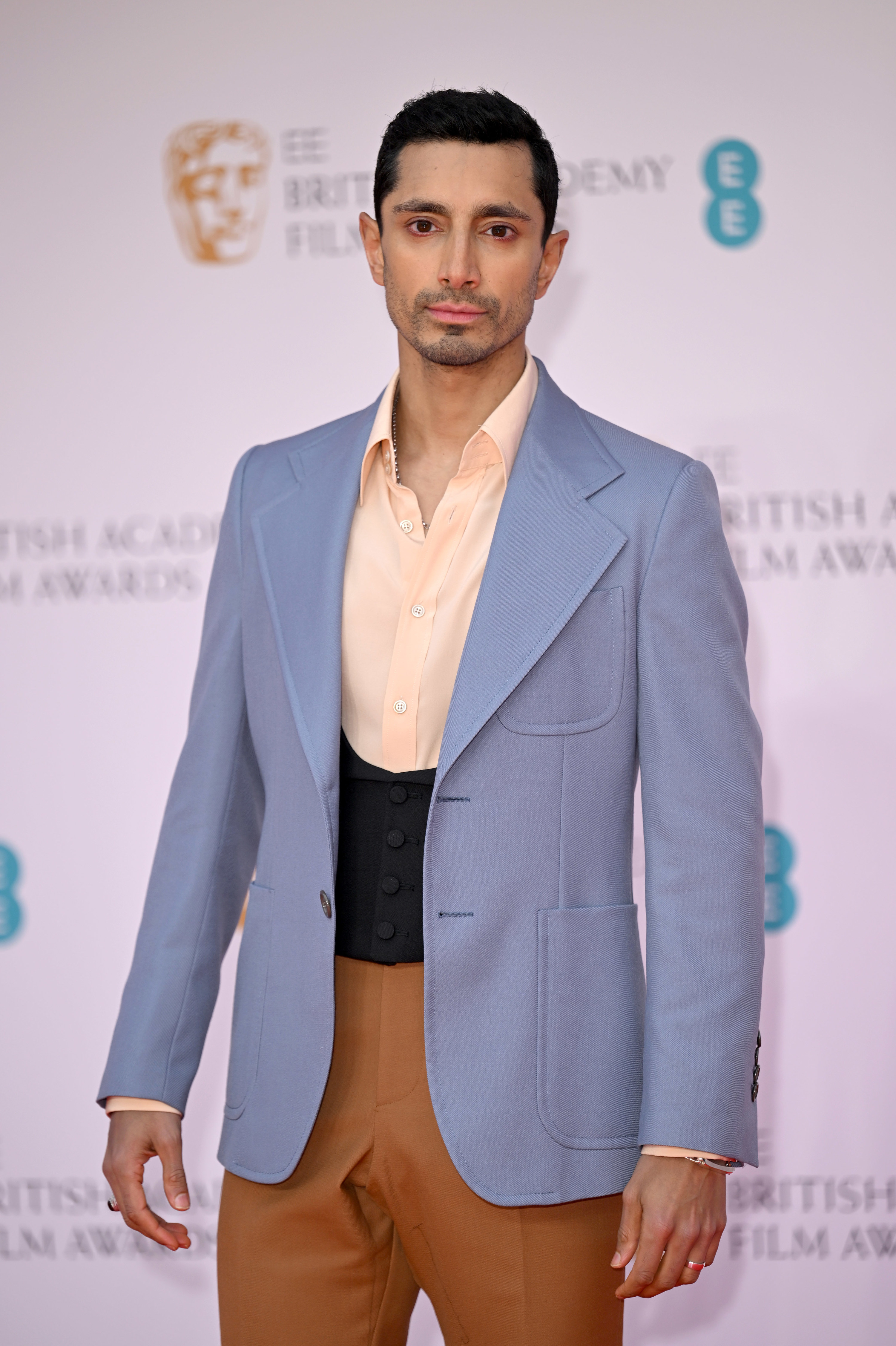 Riz wearing the outfit, which is light blue, white, black, and brown