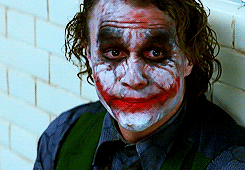 A gif of the Joker sitting and staring