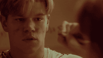 A gif of Will Hunting solving a math problem