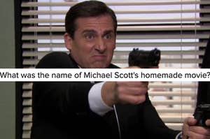A close up of Michael Scott as he holds a fake gun