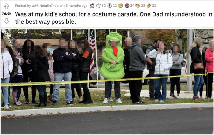 a dad wears a dinosaur costume while the rest of the parents are in regular clothes