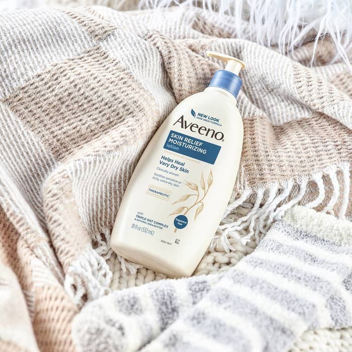a bottle of lotion on a blanket