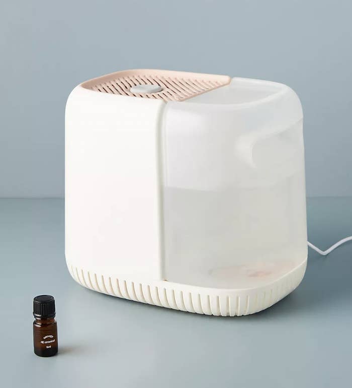 the humidifier in pink next to essential oil