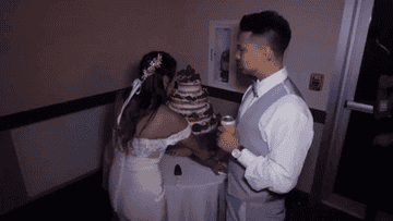 A bride points a knife at the groom in front of their wedding cake in &quot;Bridezillas&quot;