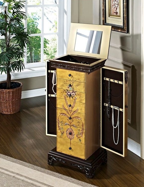 the antique jewelry armoire with the sides open