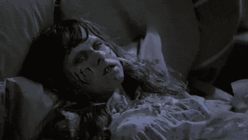 Linda Blair as a possessed child throws up on the priest in &quot;The Exorcist&quot;