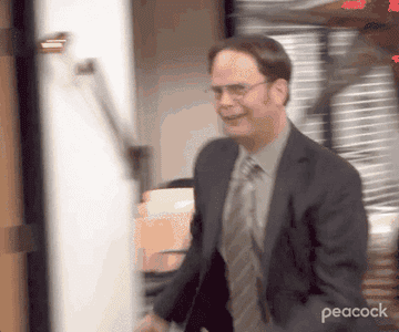 Dwight runs through the office