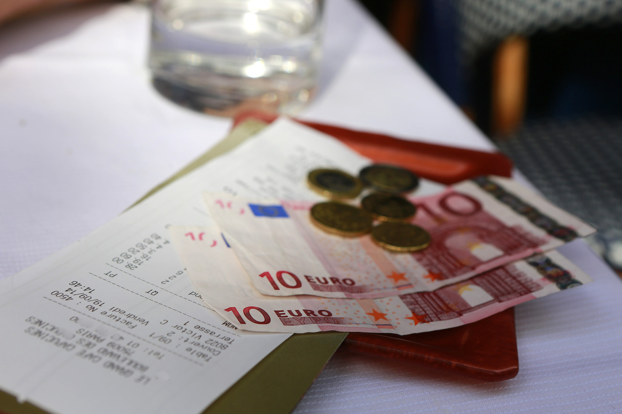 Euros on a table as a tip.