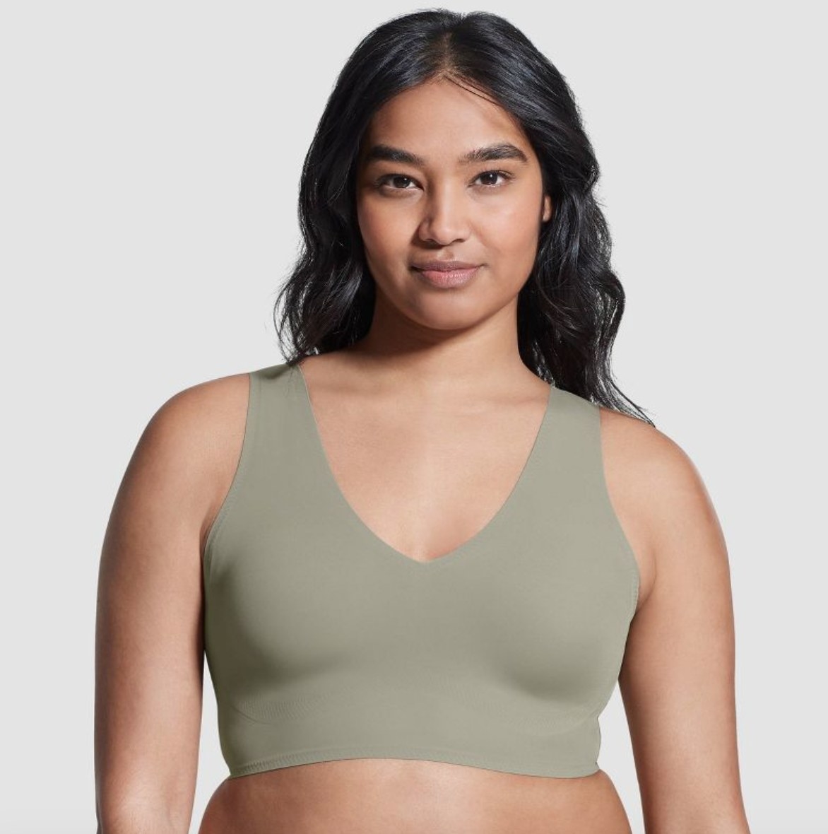 a model wearing the bra in olive green