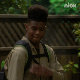 A gif of a person brushing imaginary dirt off their shoulder as they walk away