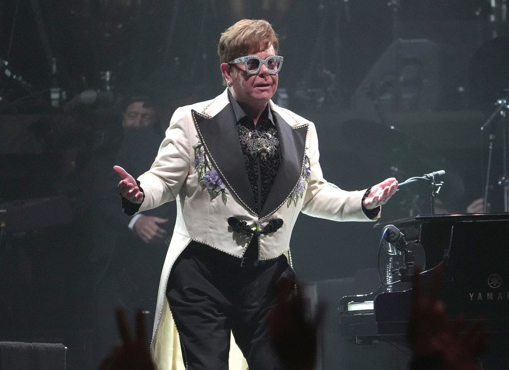 Elton performing on stage