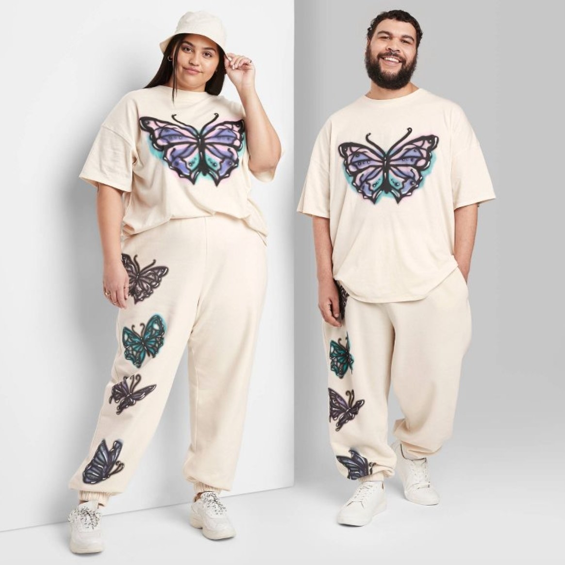 two models wearing the sweatpants and matching shirts