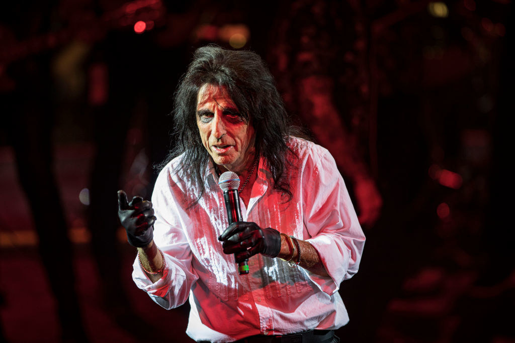 Alice Cooper on stage with a mic