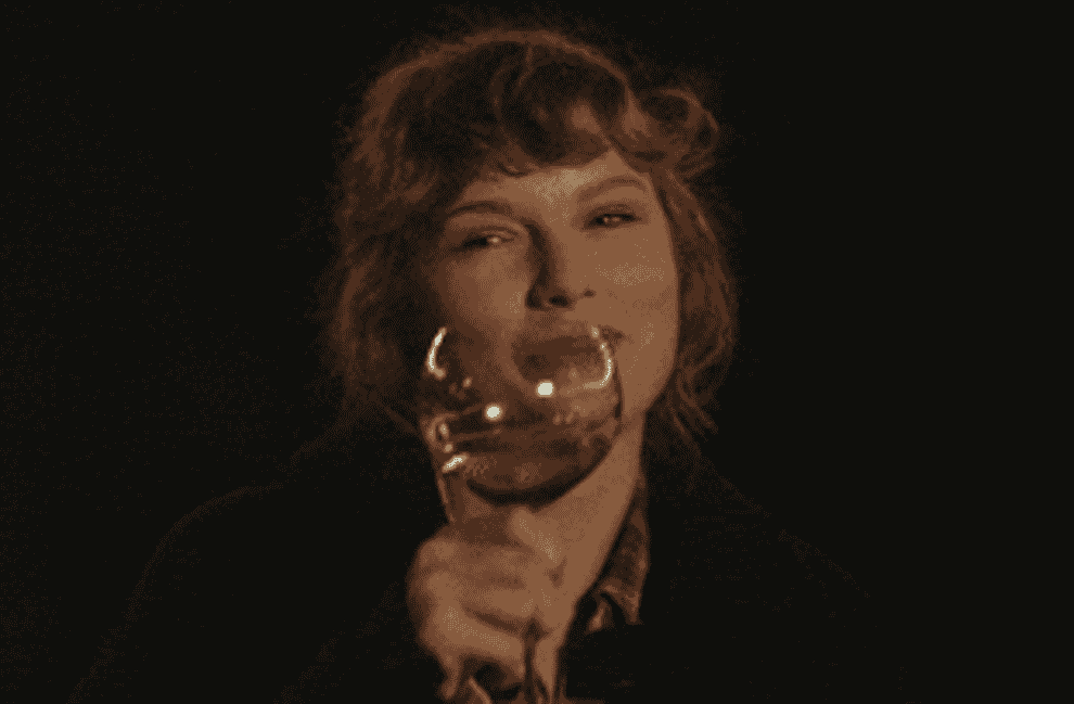 GIF of Taylor Swift holding a wine glass