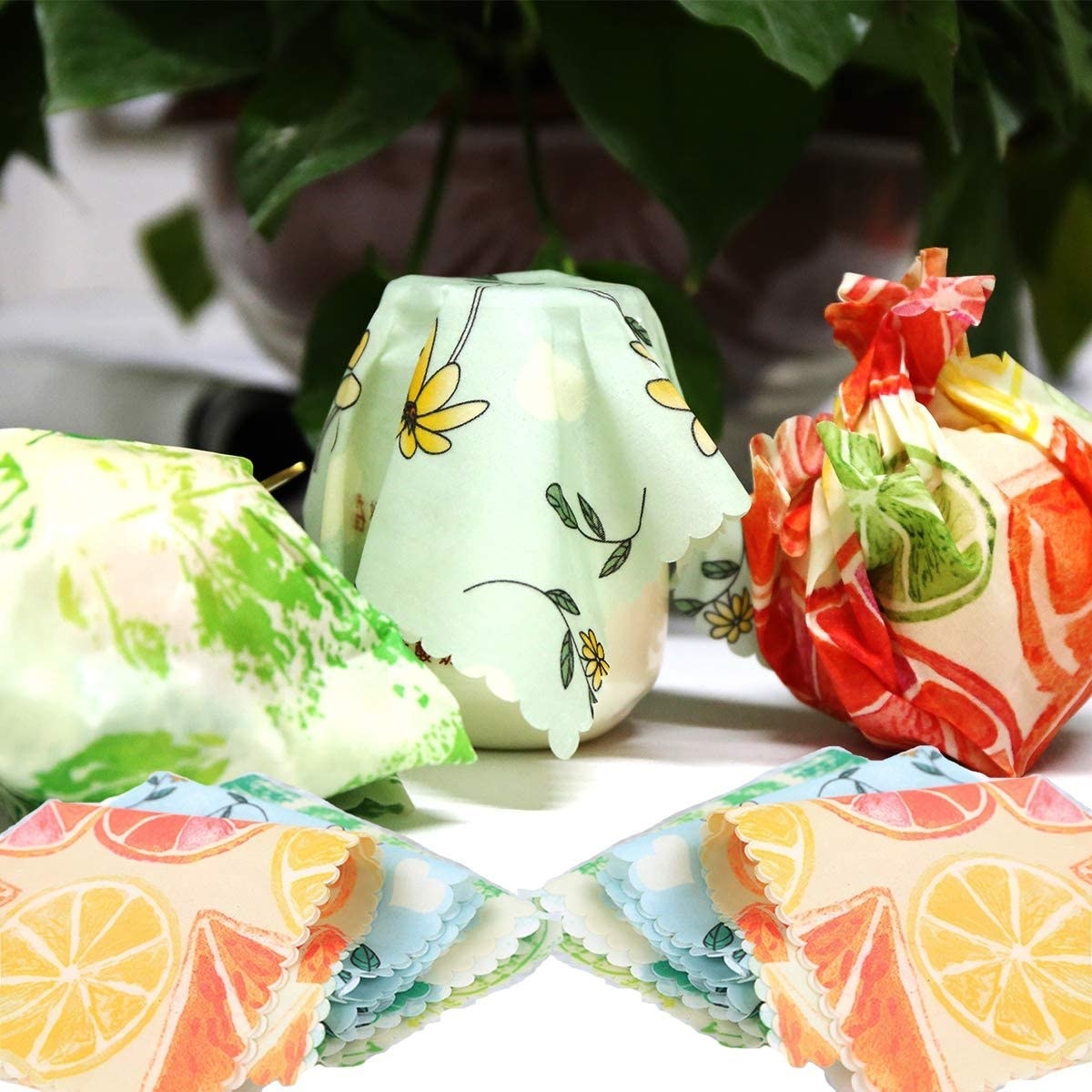 a set of beeswax wraps over jars