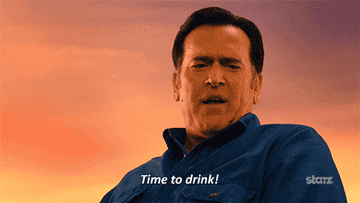 GIF of Bruce Campbell from Ash vs. Evil Dead saying &quot;Time to drink!&quot;
