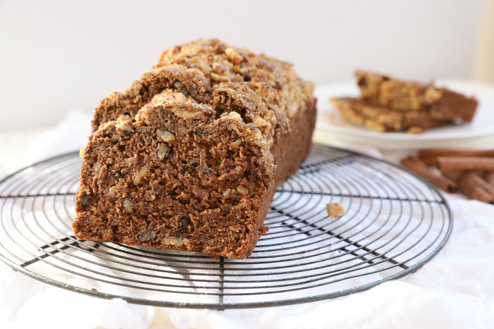 Banana bread filled with nuts cools on rack