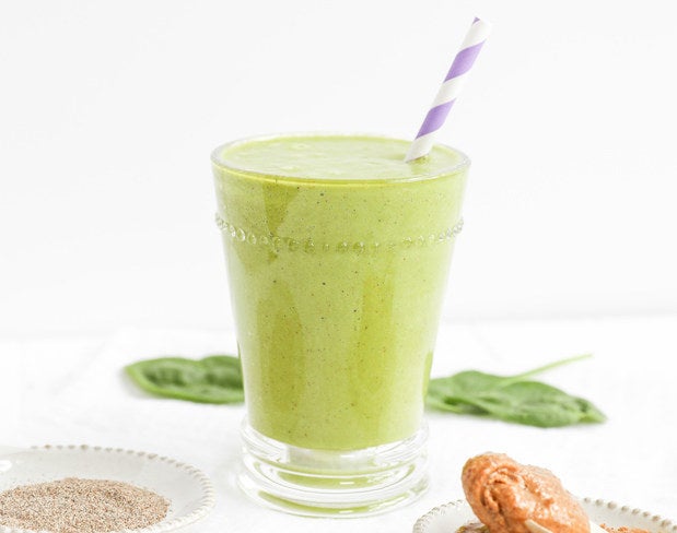 Green smoothie with paper straw