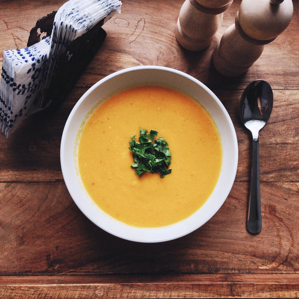 Butternut squash soup in a bowl with garnish