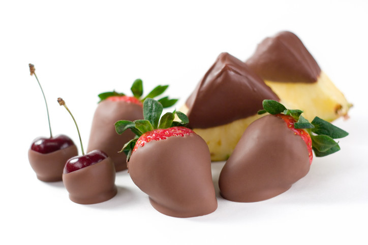 Chocolate-covered cherries, strawberries, and pineapple