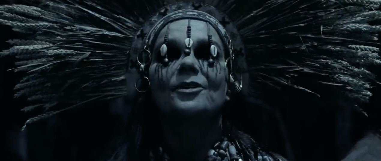 Björk wearing a headdress as the mystical seeress