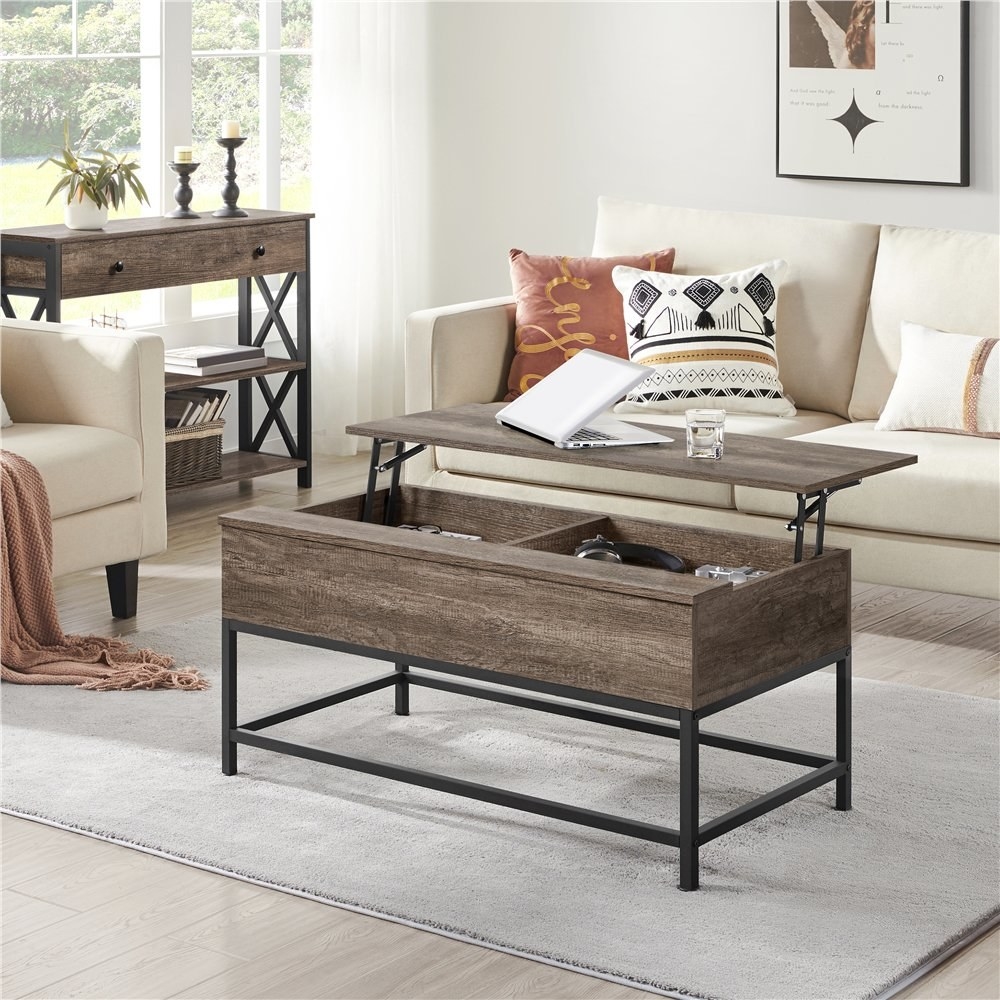 gray wooden coffee table with lift top and dark metal legs