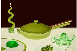 lime green pan with wooden spoon nestled on the handle