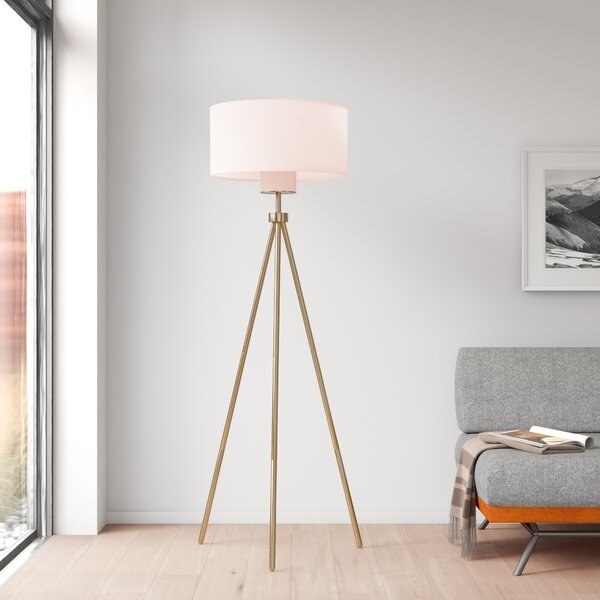 the  Old Hollywood brass tripod floor lamp with cotton drum shade