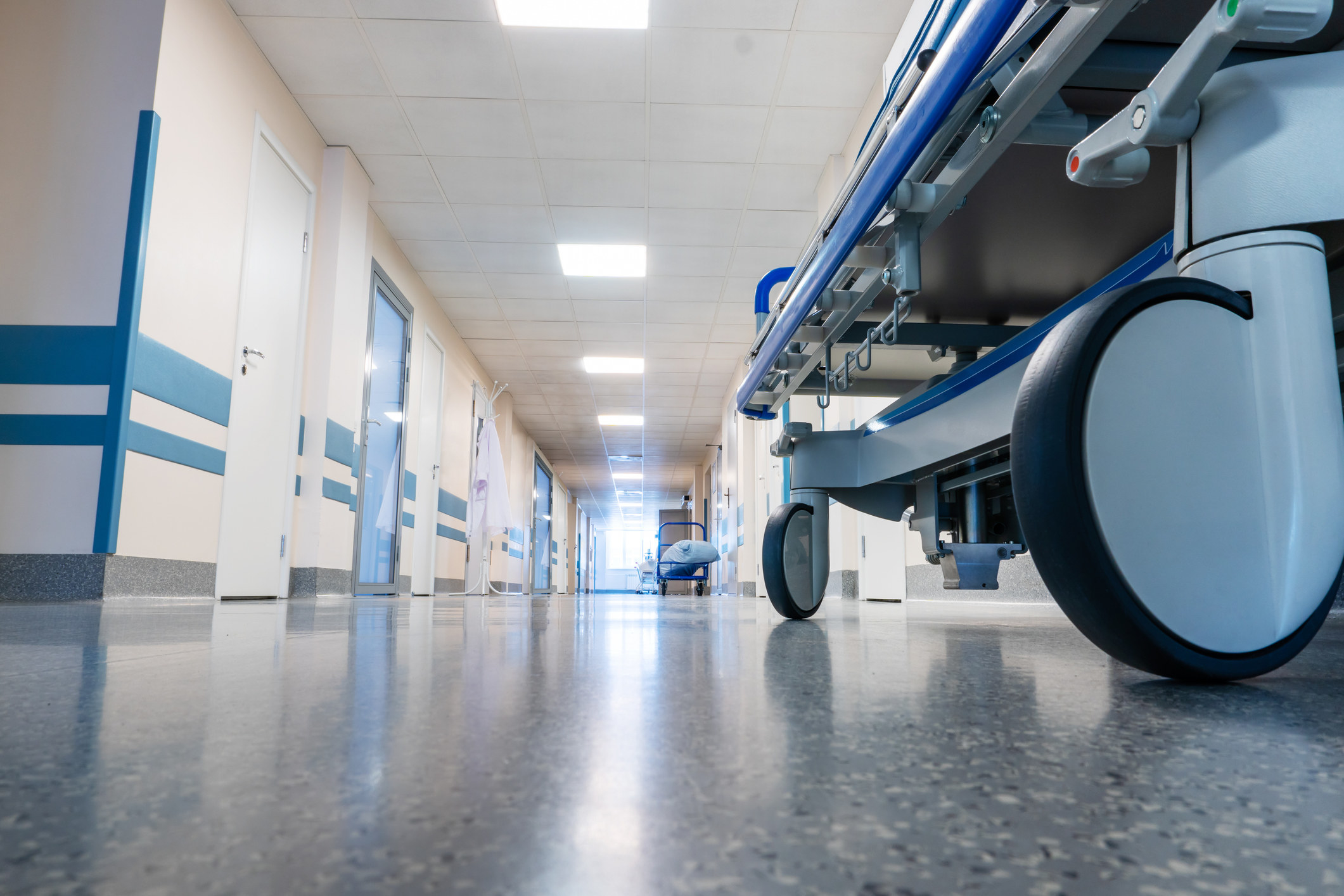 Medical bed on wheels in the hospital corridor