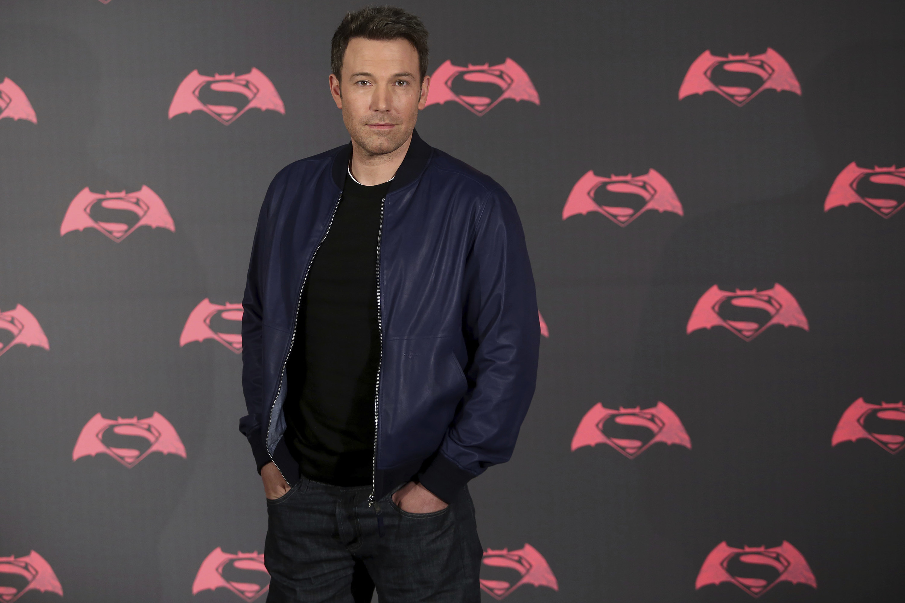 Ben at the Batman V Superman premiere, wearing a black t-shirt, navy bomber jacket and dark jeans