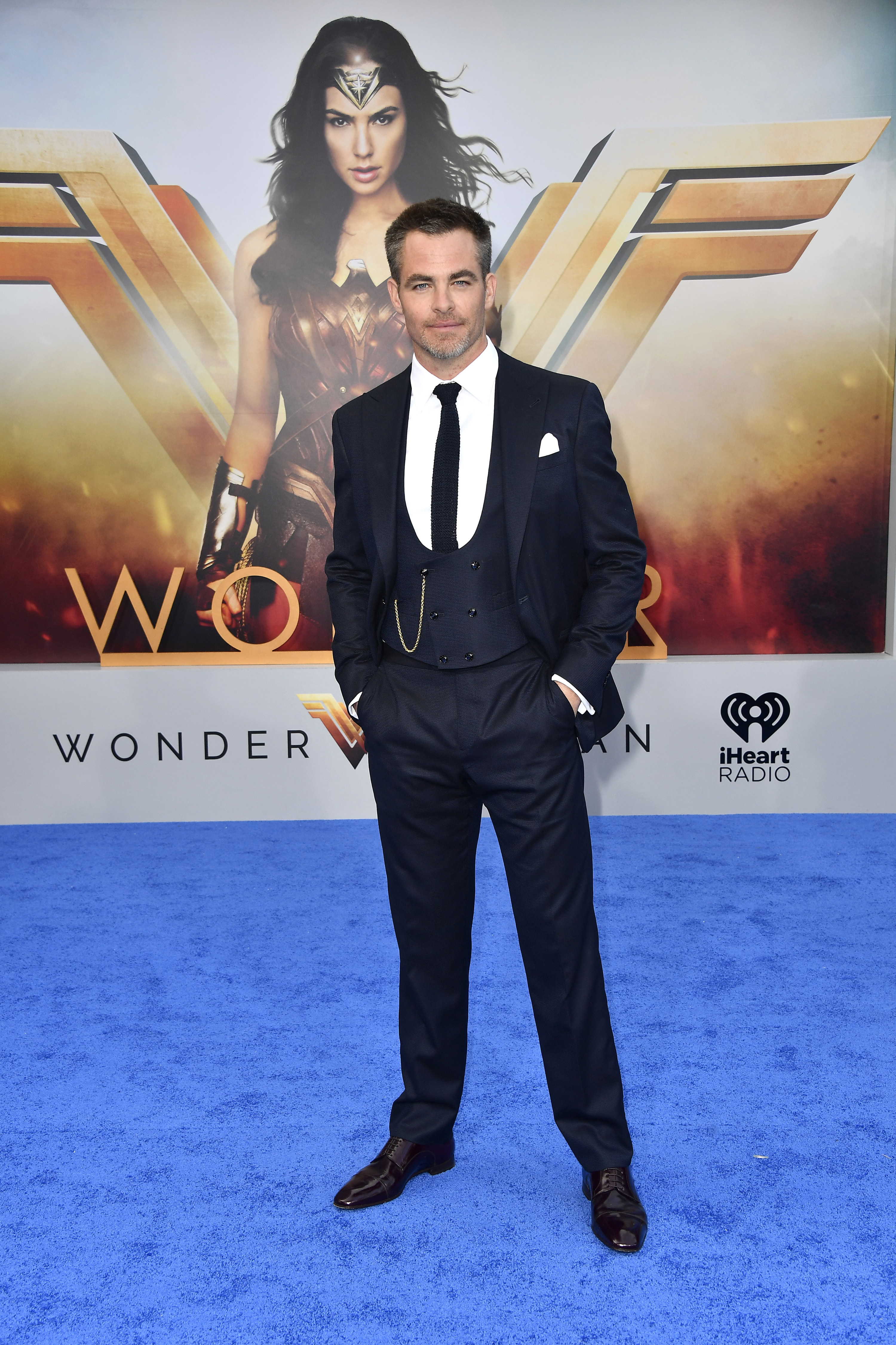 Chris at the Wonder Woman premiere, wearing a black three piece suit with a white shirt.