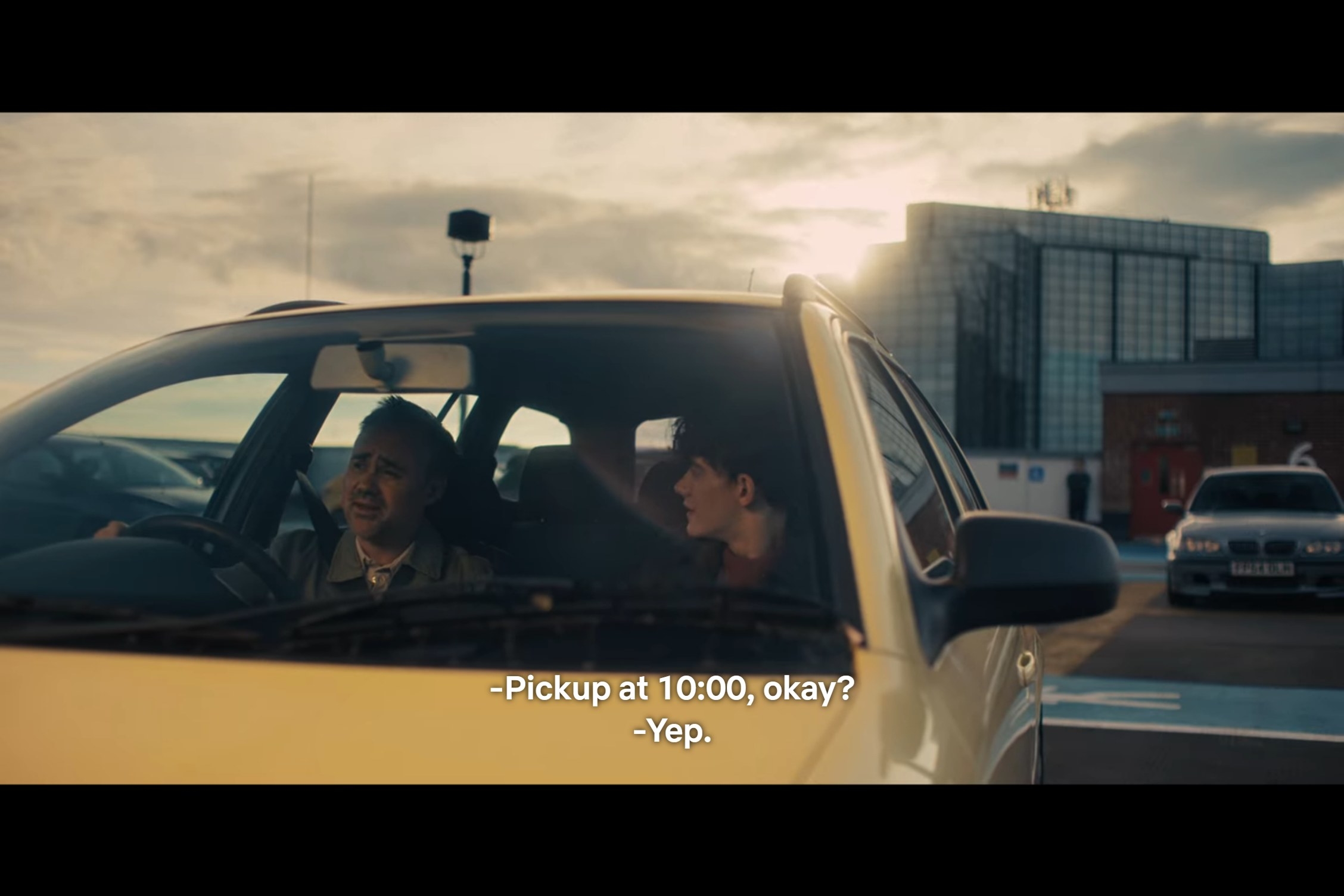 Julio says, &quot;Pickup at 10:00, okay?&quot; and Charlie replies, &quot;Yep&quot; as they sit in the car together