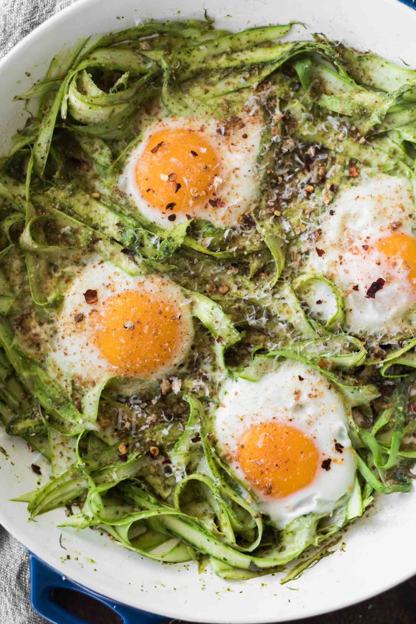Baked eggs with shaved asparagus and pesto