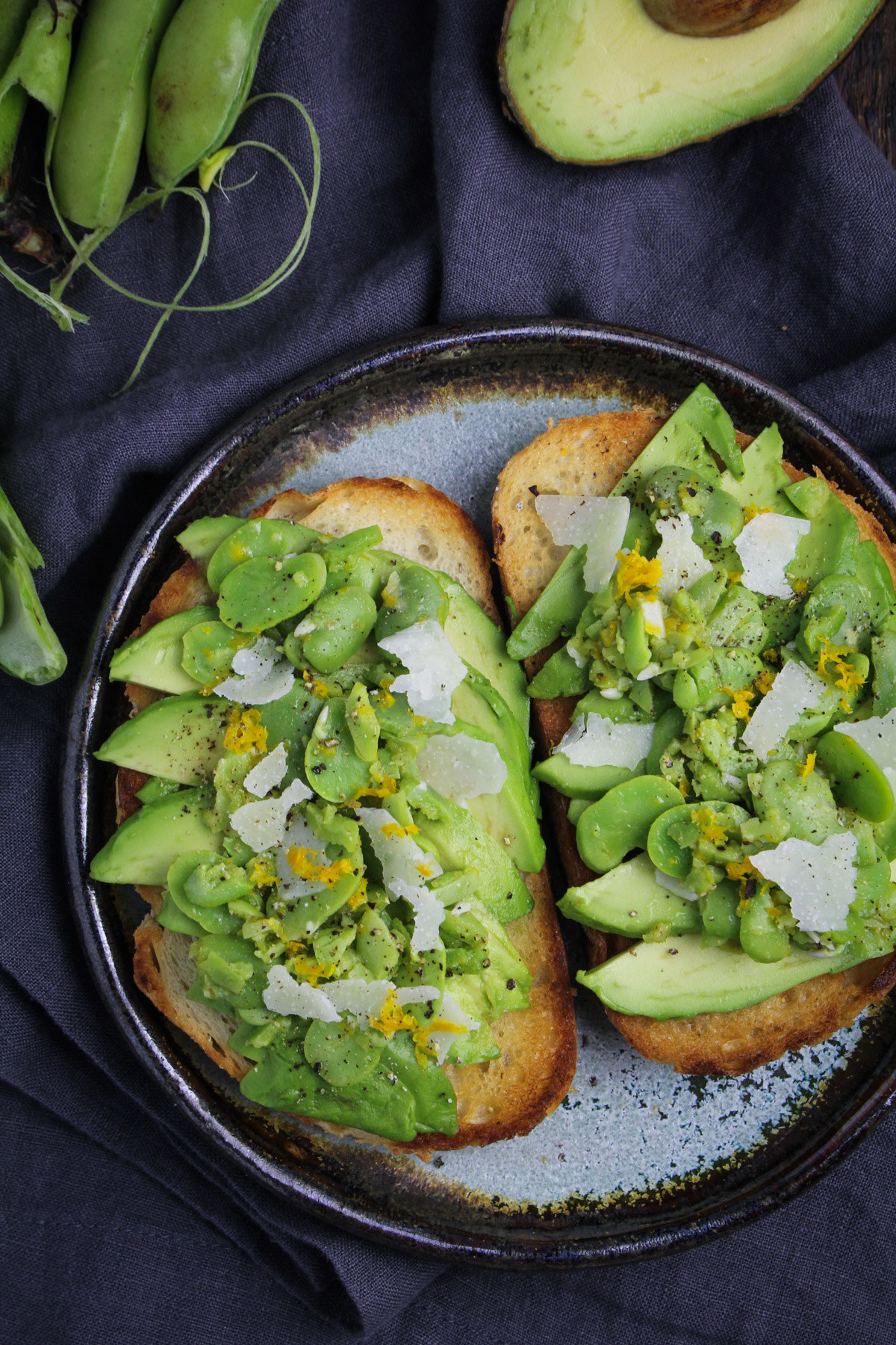 Avocado toast with fava beans and cheese