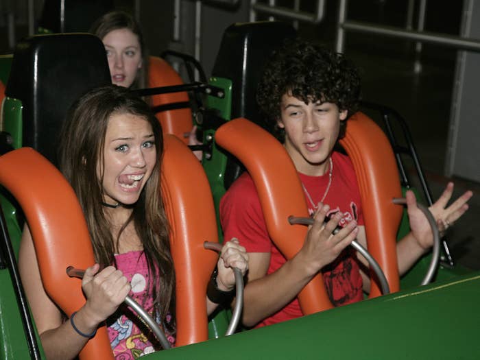 Miley and Nick as teenagers on a rollercoaster ride