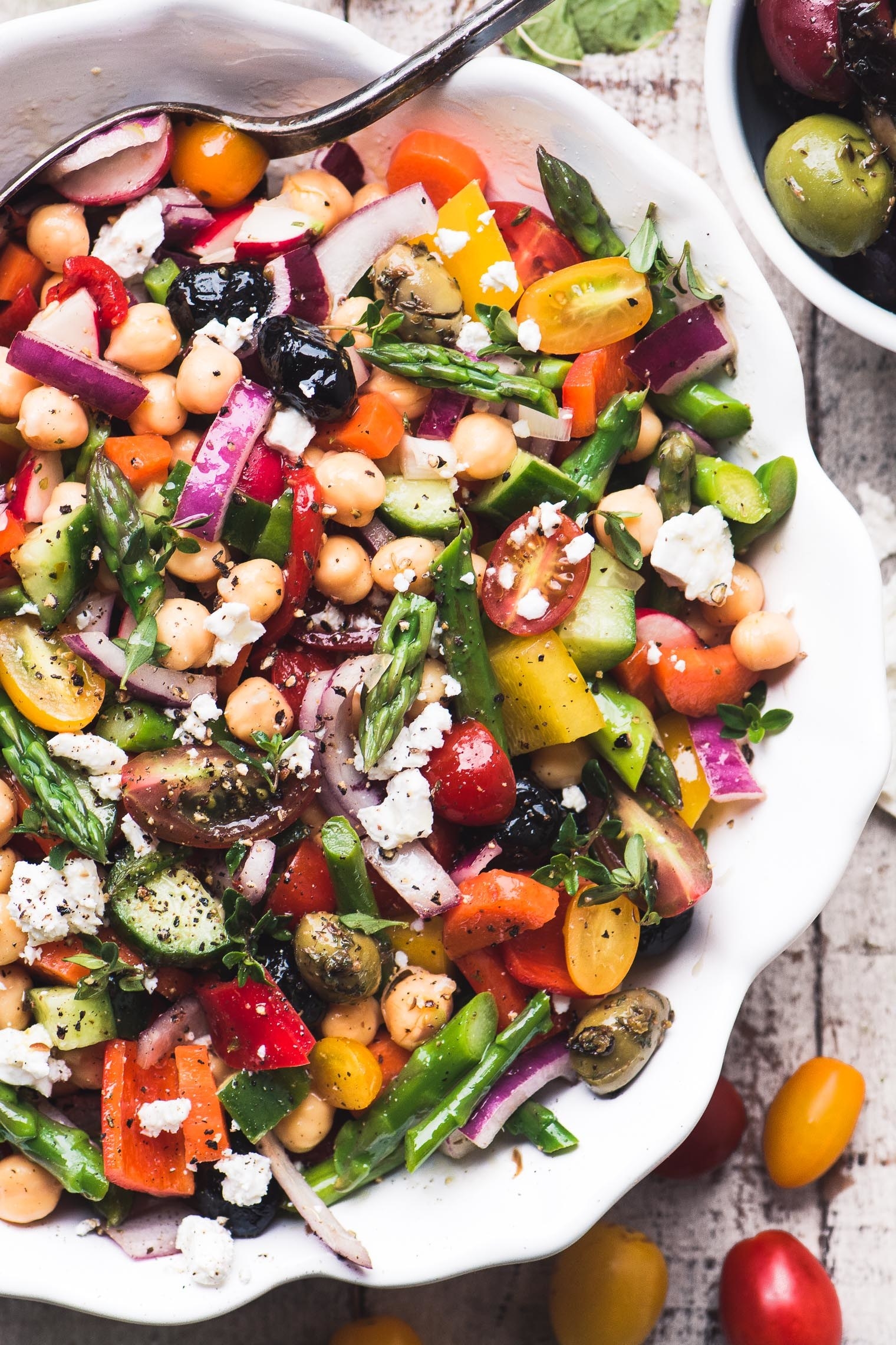 Asparagus salad with colorful vegetables, chickpeas, and Feta
