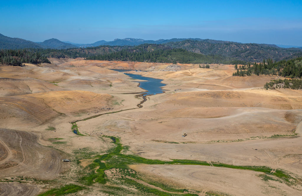 The land around the dwindling lake is brown and devoid of life