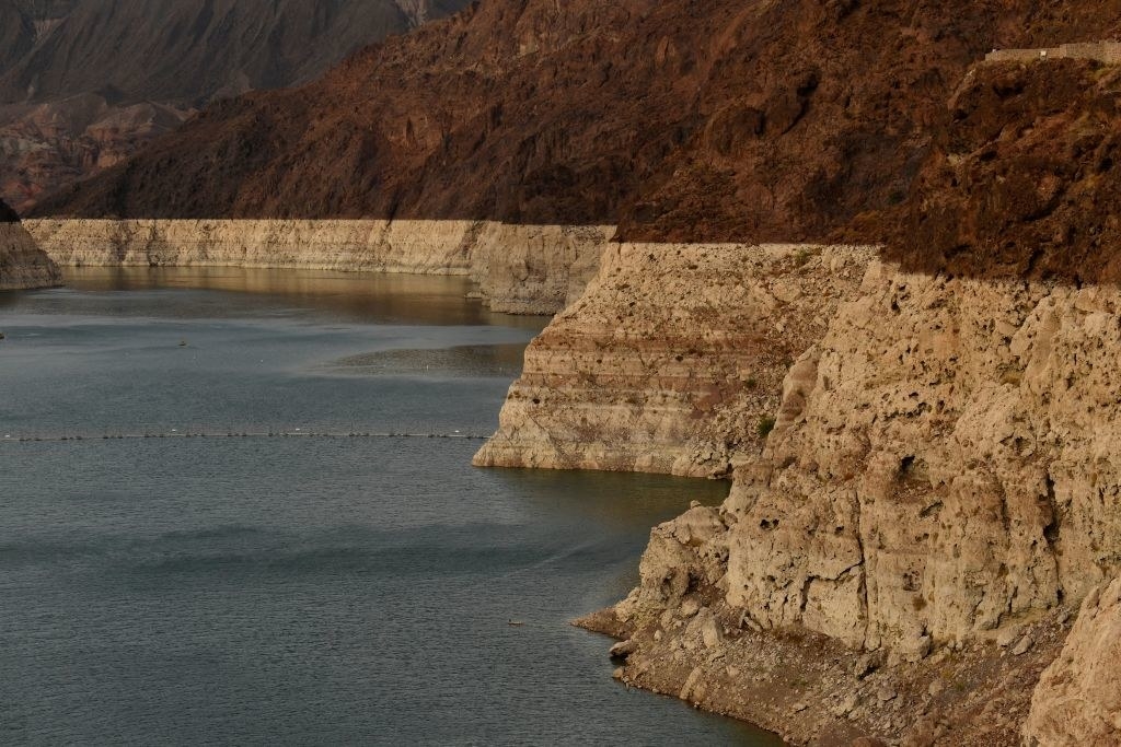 The cliffs on the edge of the lake show clearly darker lines where water used to be