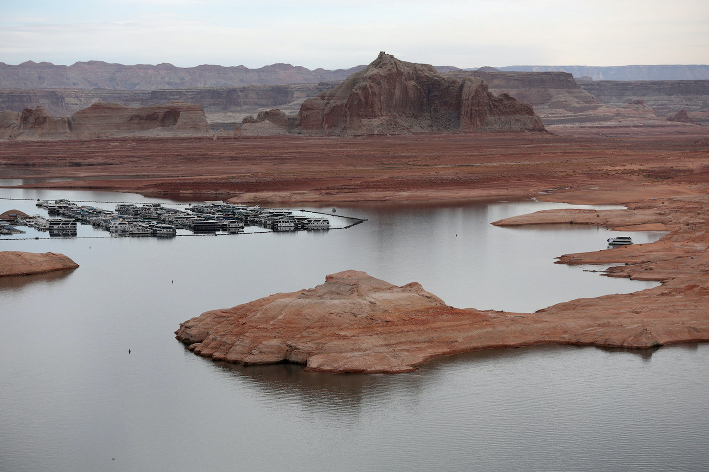 What once appeared to be a small island is now fully exposed and looks like a large rock formation that is connected to the land outside the lake