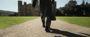 Bates walking up to the Downton Abbey estate